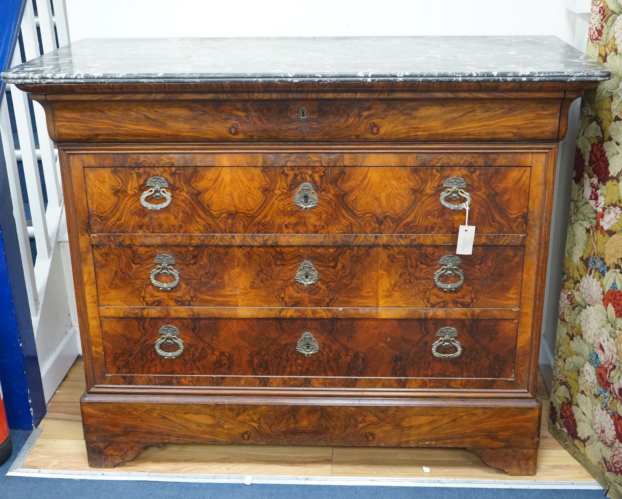 A 19th century French marble top walnut commode, width 129cm, depth 60cm, height 104cm